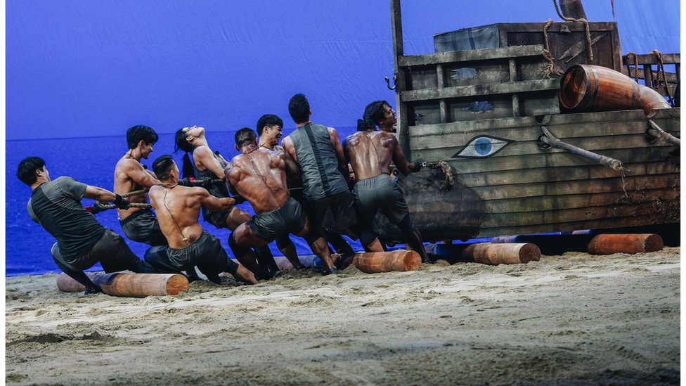 Contestants try to drag a two-tonne ship from one point to another